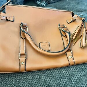 Burnt Orange purse with side tassels.